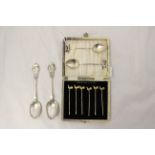 Two George V silver teaspoons with running fox finials on spiral twist stems,