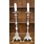 A pair of large silver plated candlesticks, gothic revival style,