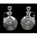 A Pair of Victorian etched glass claret jugs,