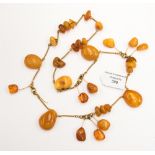 A Baltic amber, early 20th Century necklace, polished ambers, honeycomb and other shades,