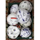 Two boxes of assorted football shirts and signed balls to include Non-League interest,