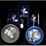 Three boxed Swarovski flowers,