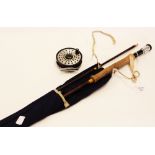 A Hardys 8ft 6 inch hollow fibre fly fishing rod in a cloth sleeve,