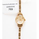 A ladies' gold plated Longines wristwatch on a 9 ct gold bracelet, gross weight 17.9 grms approx.