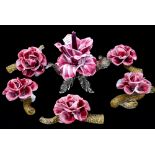 A garniture of five Murano glass flowers and central floral candlestick,