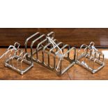 A pair of hallmarked silver miniature toast racks together with a hallmarked silver toast rack,