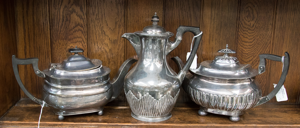 A Walker & Hall EPNS teapot, with a Walker & Hall EPNS coffee pot and un-named teapot,