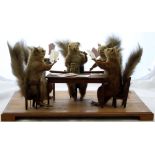 Taxidermy: a Victorian group of red squirrels of disrepute, smoking, drinking and gambling,