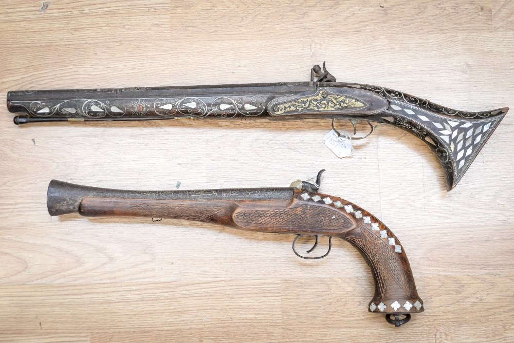 Two decorative reproduction pistols inlaid with mother-of-pearl