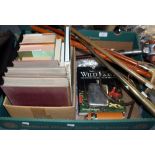 A box of assorted equestrian and hunting ephemera, including books, horns,