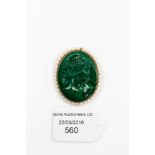 A malachite carved cameo brooch/pendant of a classical lady with cultured pearl border,