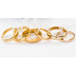 Six gold wedding bands, comprising two 9 ct, 4.9 grms approx., two 18 ct, 6.0 grms approx.