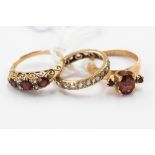 Three 9 ct gold dress rings, comprising a white stone set full eternity and two garnet set,