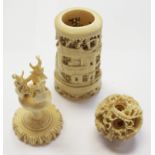 A carved Chinese brush pot, with a carved Ivory puzzle ball on stand,