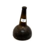 An 18th Century, onion shaped, glass bottle, let in foot,