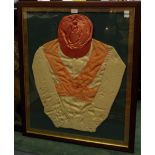 A 20th Century framed pink silk jockey's cap and pink and white silk jacket,