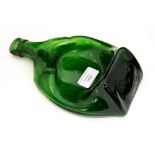 A Reg Moon squashed Squires Gin bottle, having embossed marks to the upper edge,