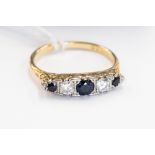 A sapphire and diamond five stone boathead 18 ct yellow gold ring, central blue sapphire approx. 3.