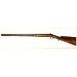 An antique single barrel 16 bore percussion shotgun fitted with a back action lock marked Hellis or