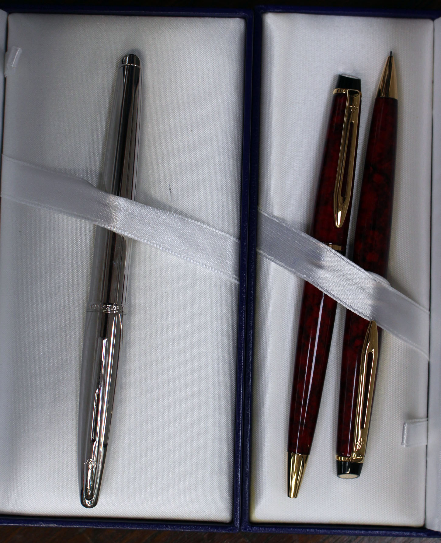 A cased set of Waterman Burgundy pens,