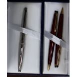 A cased set of Waterman Burgundy pens,