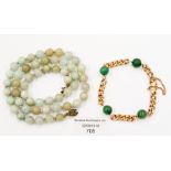 A 15 ct gold curb-link bracelet, with four jade beads, approx. 16.