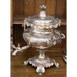 An 19th Century plated tea urn or samovar, possibly Old Sheffield Plate with a vented lid,