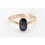 A sapphire ring, set in possibly 15 ct gold, rub-over setting, gross weight approx. 2.