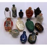 A collection of Chinese scent and snuff bottles, including cased glass, carved mother of pearl,