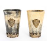 A pair of horn beakers metal mounted to base and a monogram shields to the front (2)
