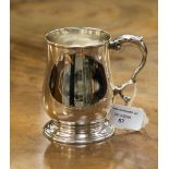 A baluster silver mug, double scroll handle and stepped foot, hallmark London 1971, maker C.J.