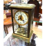 A brass and onyx eight day mantle clock, with a white enamelled chapter dial,