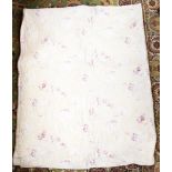 A late Victorian / early Edwardian hand stitched cotton quilt on a cream background,