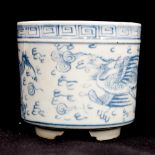 A Chinese blue and white brush pot supported on three elongated feet,