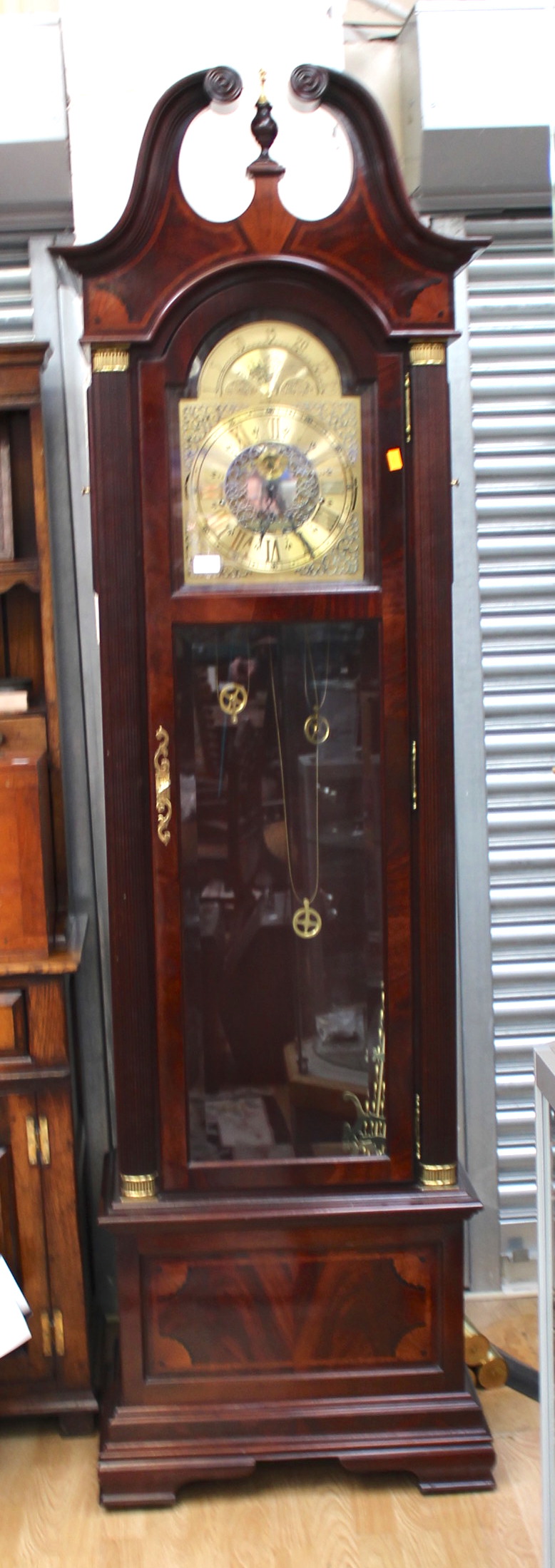 A Howard Miller mahogany cased longcase clock, with an eight day movement,