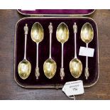 A cased set of six Victorian silver Apostle teaspoons, gilt bowls, London 1881, 2.