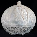 A large carved mother of pearl shell,