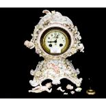 A florally encrusted mantle timepiece,
