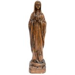 A carved wood figure of the Virgin Mary,