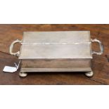 A George VI silver desk casket with inkwells and pen tray, two hinged lids, London 1942,