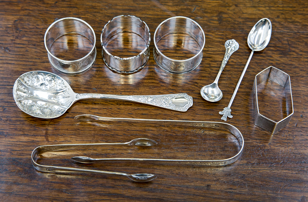 Three silver and one white metal napkin rings,silver sugar nips, London 1805, maker Thomas Wallis,