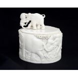 A late 19th century carved ivory box and cover,