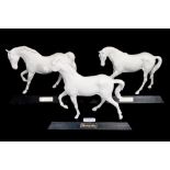 Three white Beswick Horses; Spirit of Fire, Spirit of Freedom,
