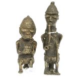A pair of Nigerian cast bronze figures, one smoking a pipe,