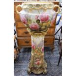 An early 20th Century pottery jardiniere on stand,