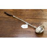 A white metal toddy ladle, the bowl inset with a silver coin,