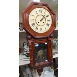 A walnut Vienna wall clock with inlay detail to the bottom,