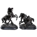 A pair of spelter mantelpiece sculptures of a fiery Horse with handler/controller,