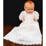 A circa 1947 ceramic baby doll,