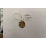 A Victorian half sovereign coin pendant, the coin dated 1880 in 9 ct gold plain mount,